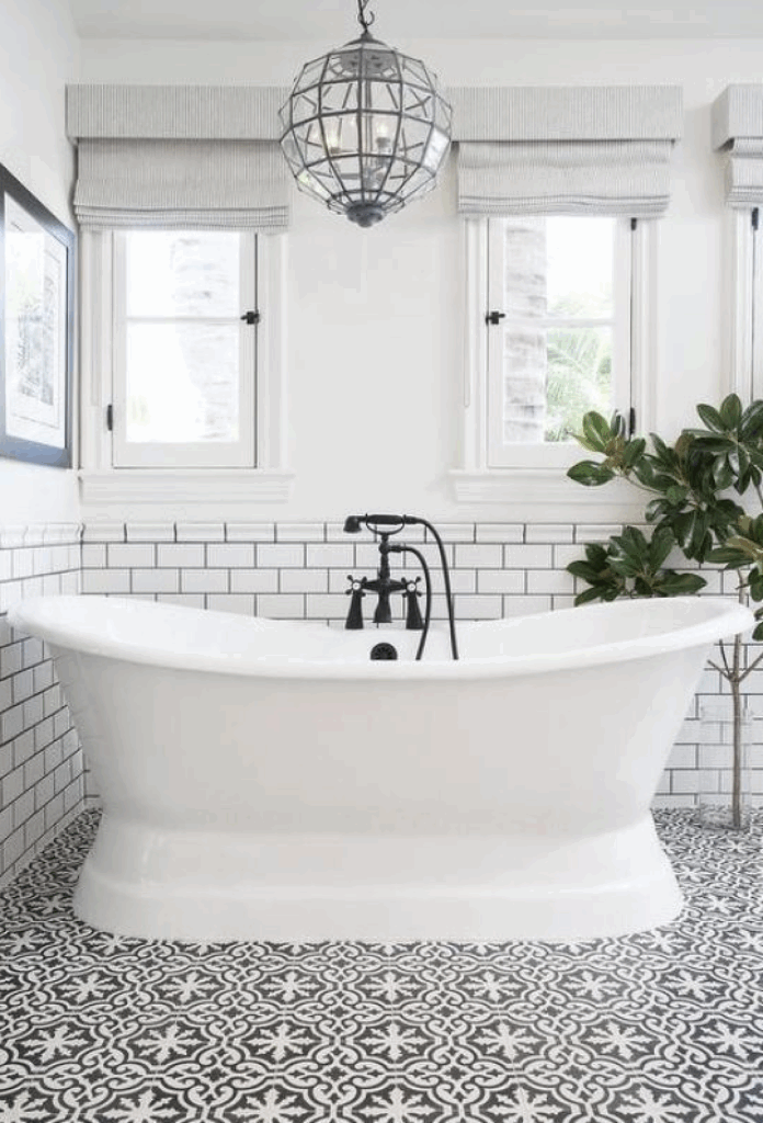 Professional contractors finishing a beautiful and sleek new bathroom remodel.
